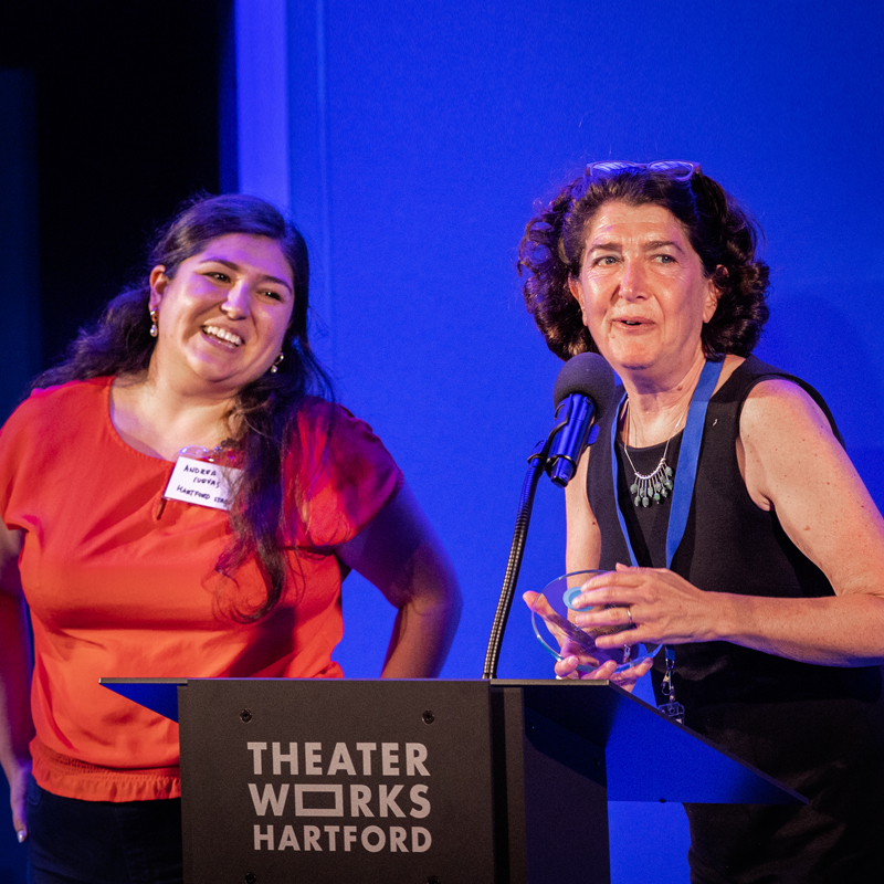 Hartford Stage Director of Marketing Andrea Cuevas and Artistic Director Melia Bensussen accepting one of the theater's awards.